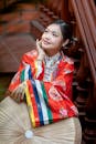 Young Woman in Traditional Asian Attire Indoors