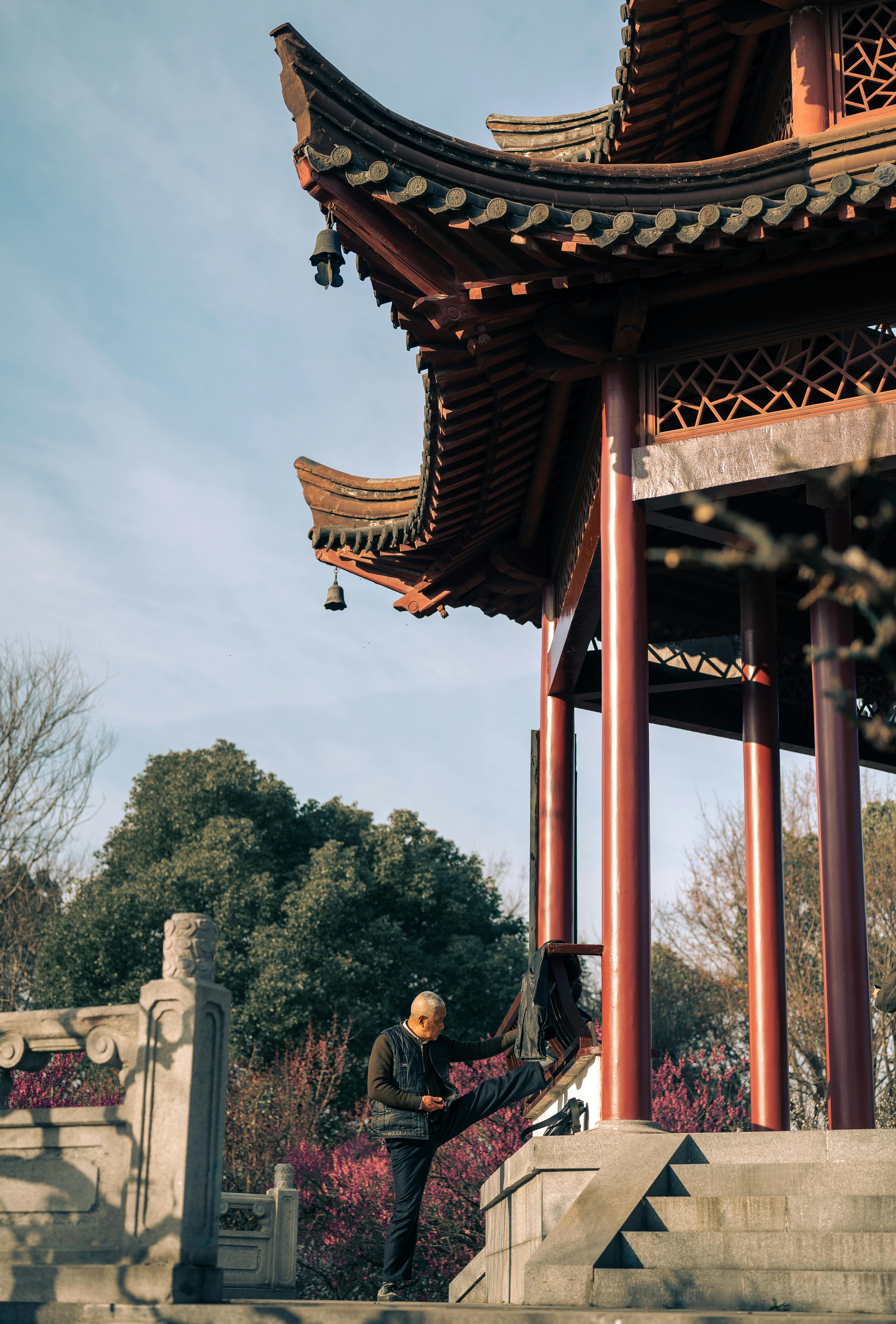 Senior Practicing Tai Chi at Nanjing Pavilion
