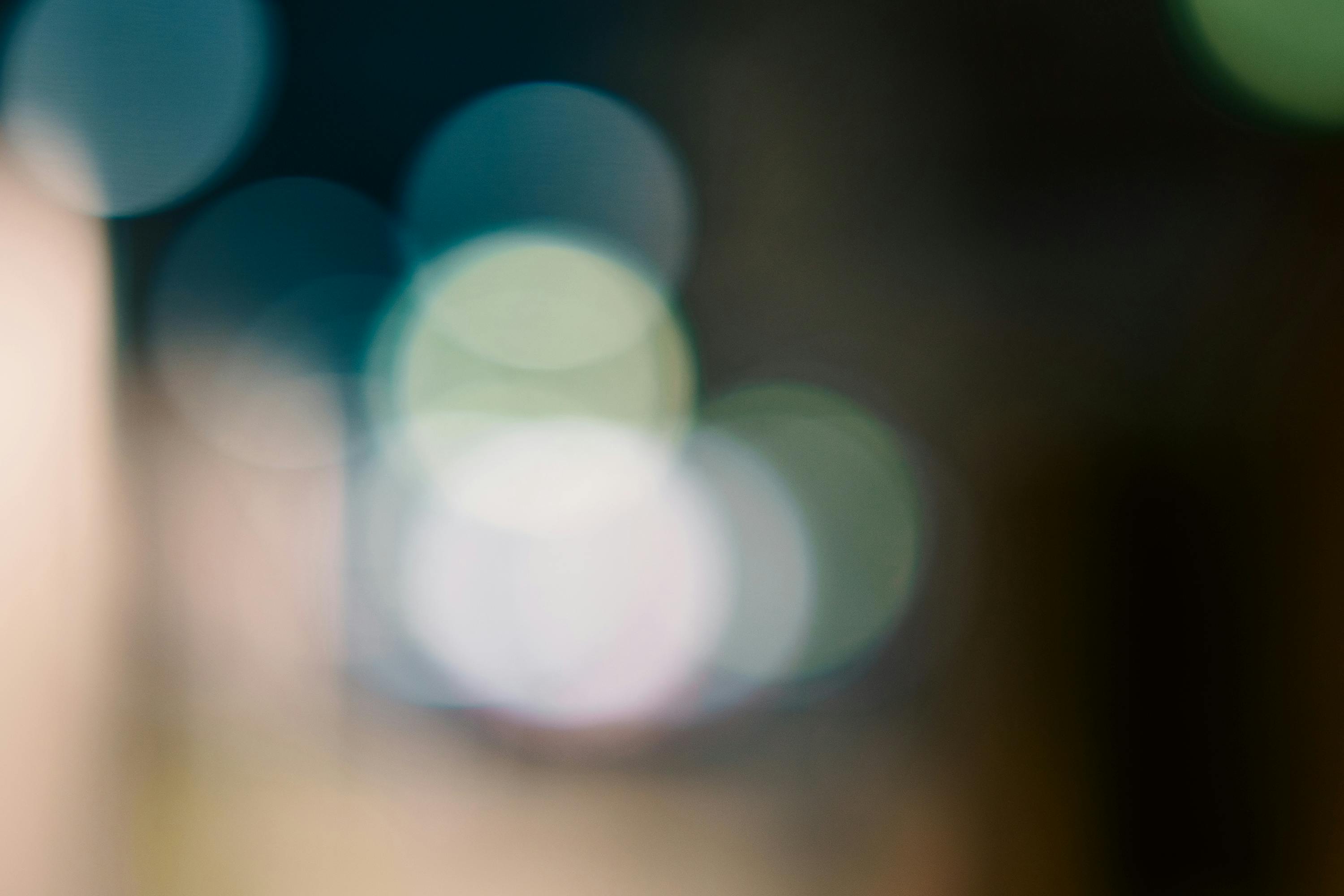 Free Abstract art image featuring soft bokeh lights and blurred color circles for creative design. Stock Photo