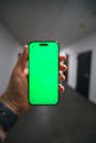 Smartphone with Green Screen in a Hallway