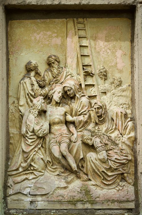 Free Historic stone relief sculpture depicting a religious scene indoors with intricate details. Stock Photo