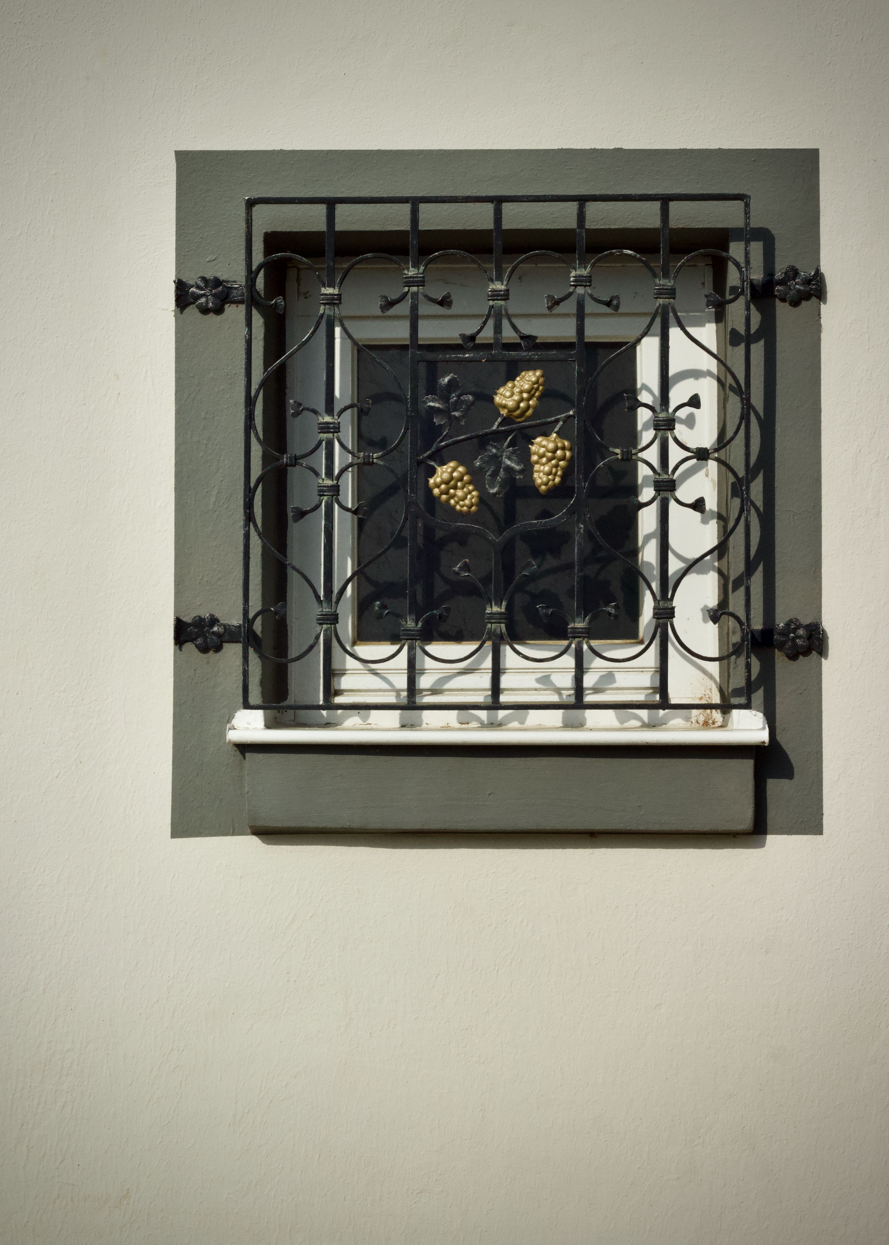 Decorative Iron Window Grate on Building · Free Stock Photo