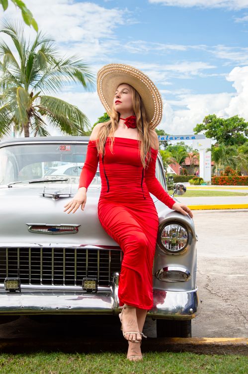 Elegant Woman in Red Dress Posing by Classic Car · Free Stock Photo