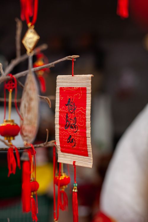 Free Festive hanging decorations with Chinese calligraphy for Chinese New Year celebration. Stock Photo