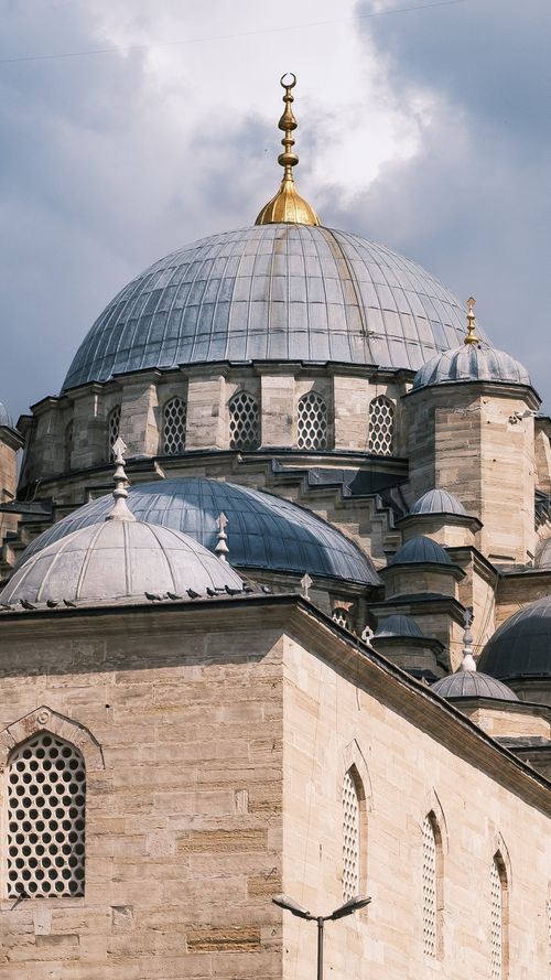 Free Close-up of the Blue Mosque dome capturing intricate architecture with a cloudy sky backdrop. Stock Photo