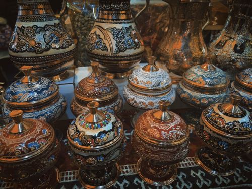 Free Showcase of intricate handcrafted pottery with vibrant designs. Perfect for traditional decor enthusiasts. Stock Photo