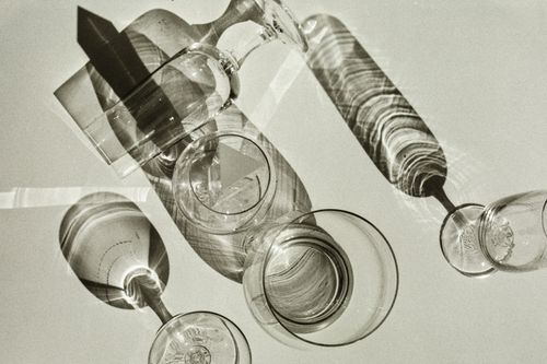 Free Elegant shadows of glassware casting patterns on a surface, showcasing a play of light and art. Stock Photo
