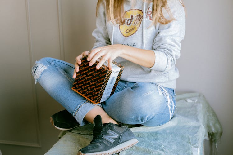 Woman Opening A Box