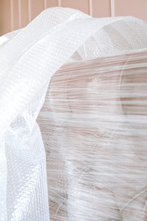 Free Sofa Wrapped In Plastic Stock Photo