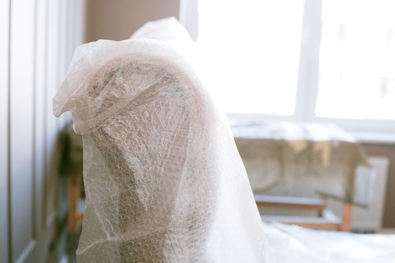 Furniture wrapped in bubble wrap for protection ahead of storage
