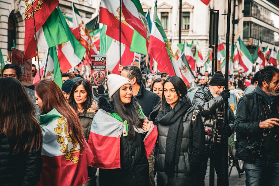 A vibrant street protest in London advocating for Iranian political change.