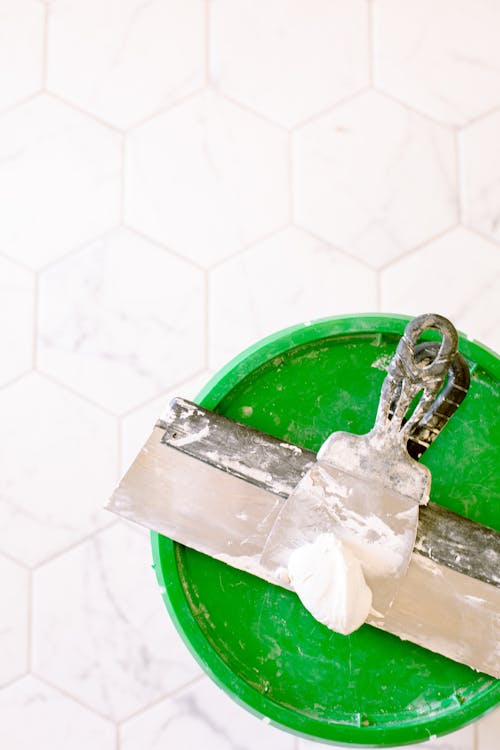 Free Green Lid with Metal Scraper Stock Photo