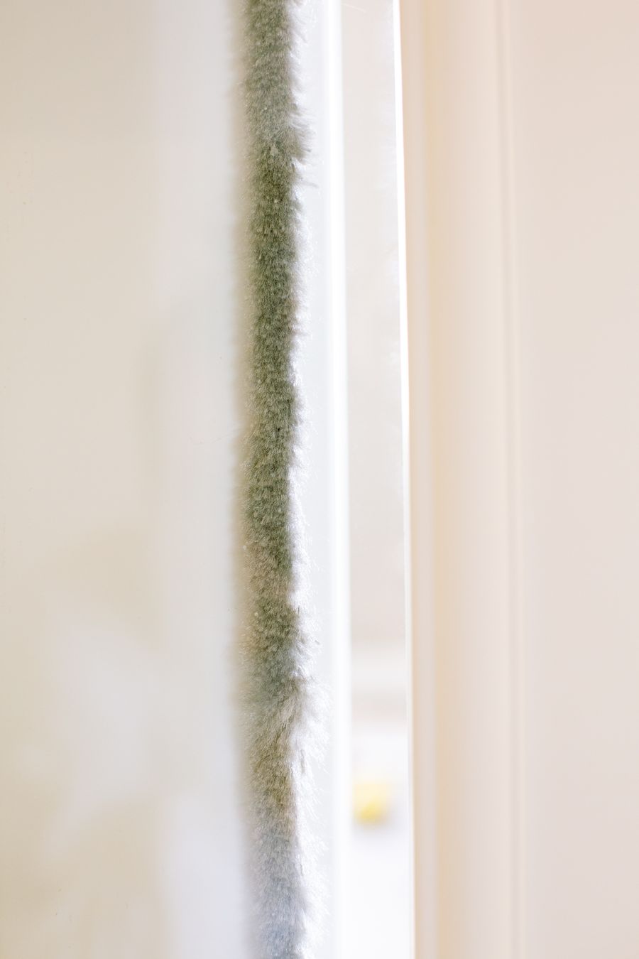 Insulation material installed on an interior wall