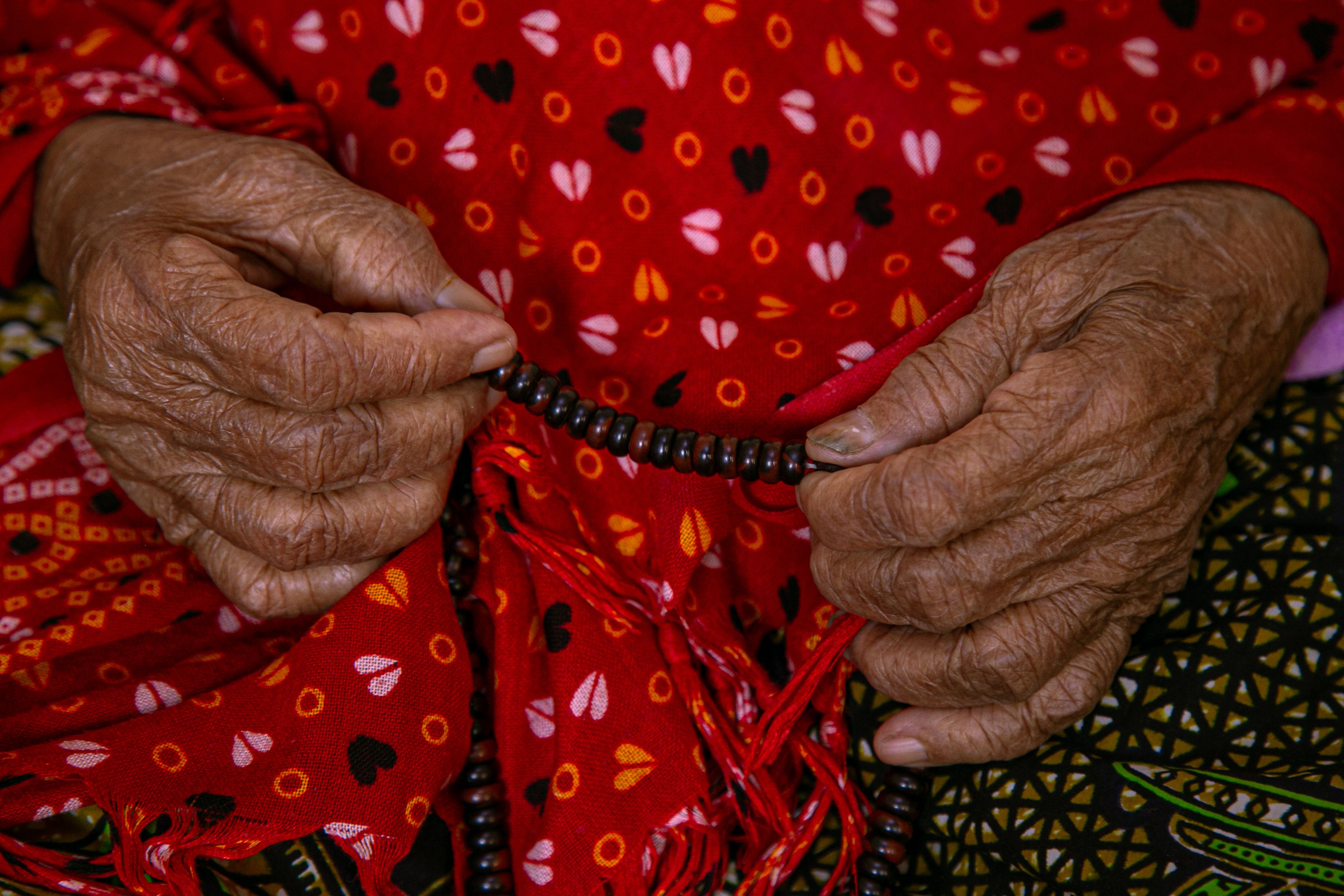 Elderly Hands Holding Prayer Beads · Free Stock Photo