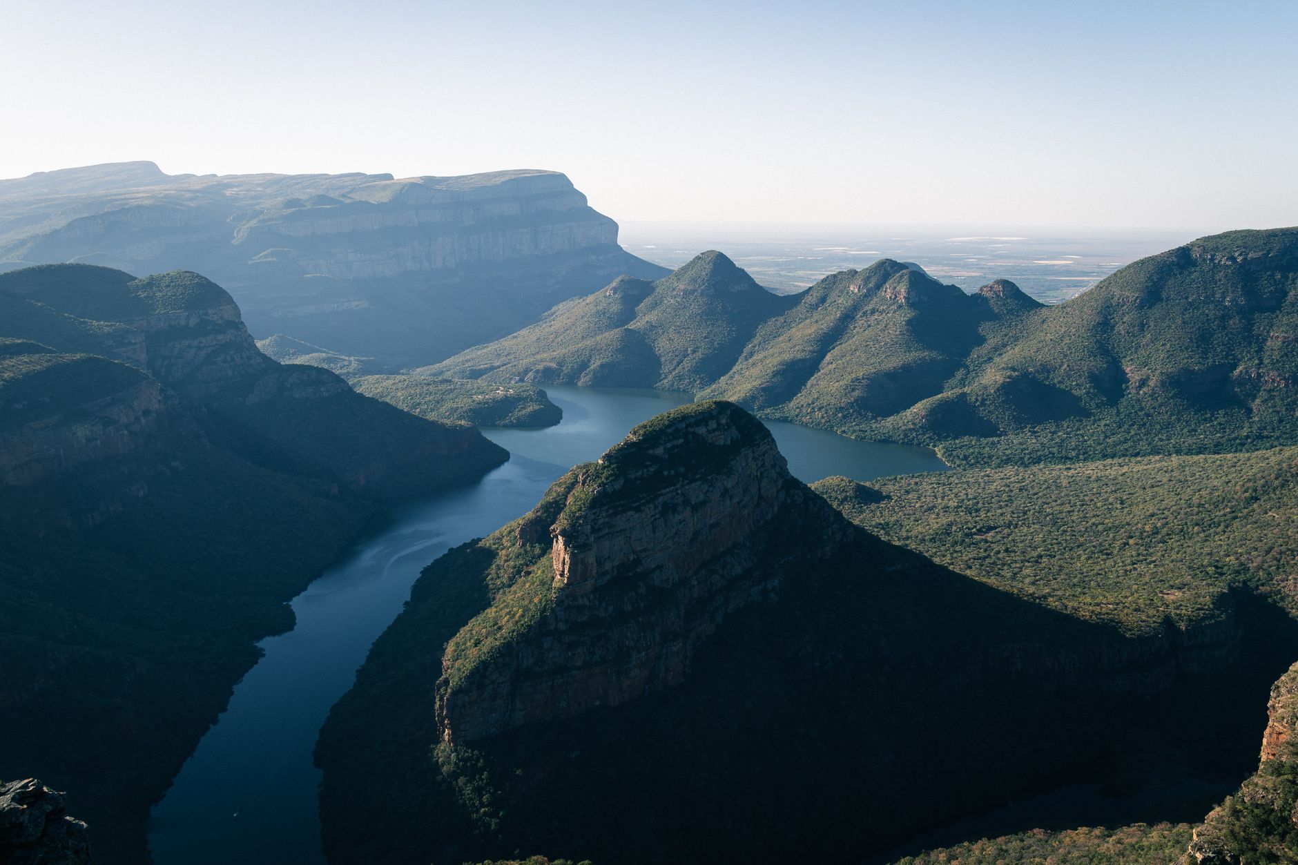 A breathtaking view of the Blyde River Canyon's lush greenery and winding waterways in South Africa.