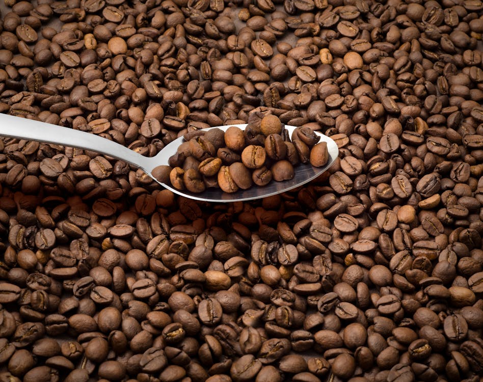 Brown Coffee Beans On A Spoon