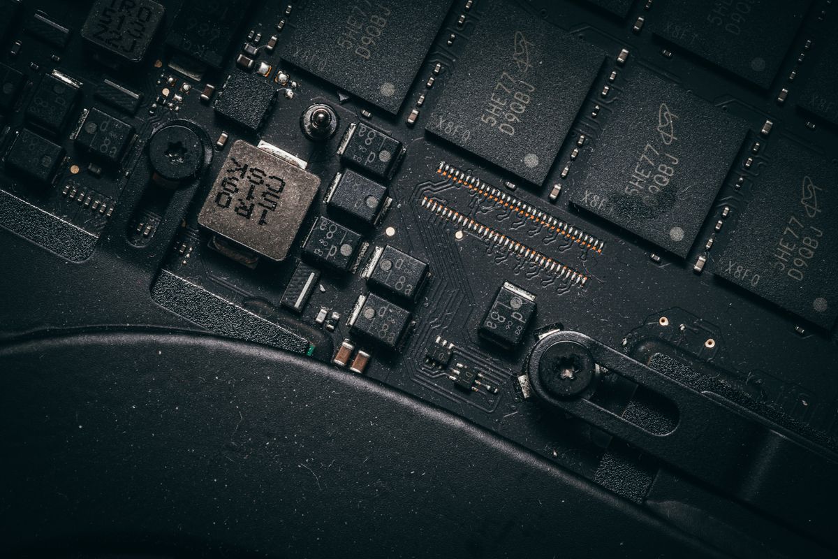Macro view of an electronic circuit board, the kind of hardware AI monitoring agents read sensors from