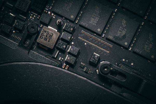 Macro view of unbranded microchips on a circuit board. Photo by Jakub Pabis on Pexels.