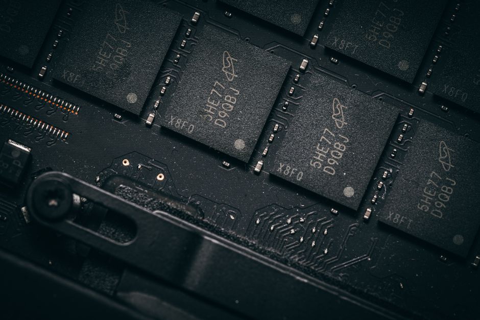 Detailed shot of microchips on a circuit board, showcasing electronic technology and precision engineering. Detailed shot of microchips on a circuit board, showcasing electronic technology and precision engineering.