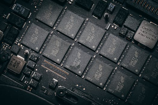 Detailed view of electronic circuit board components showcasing microchips and technology intricacies.