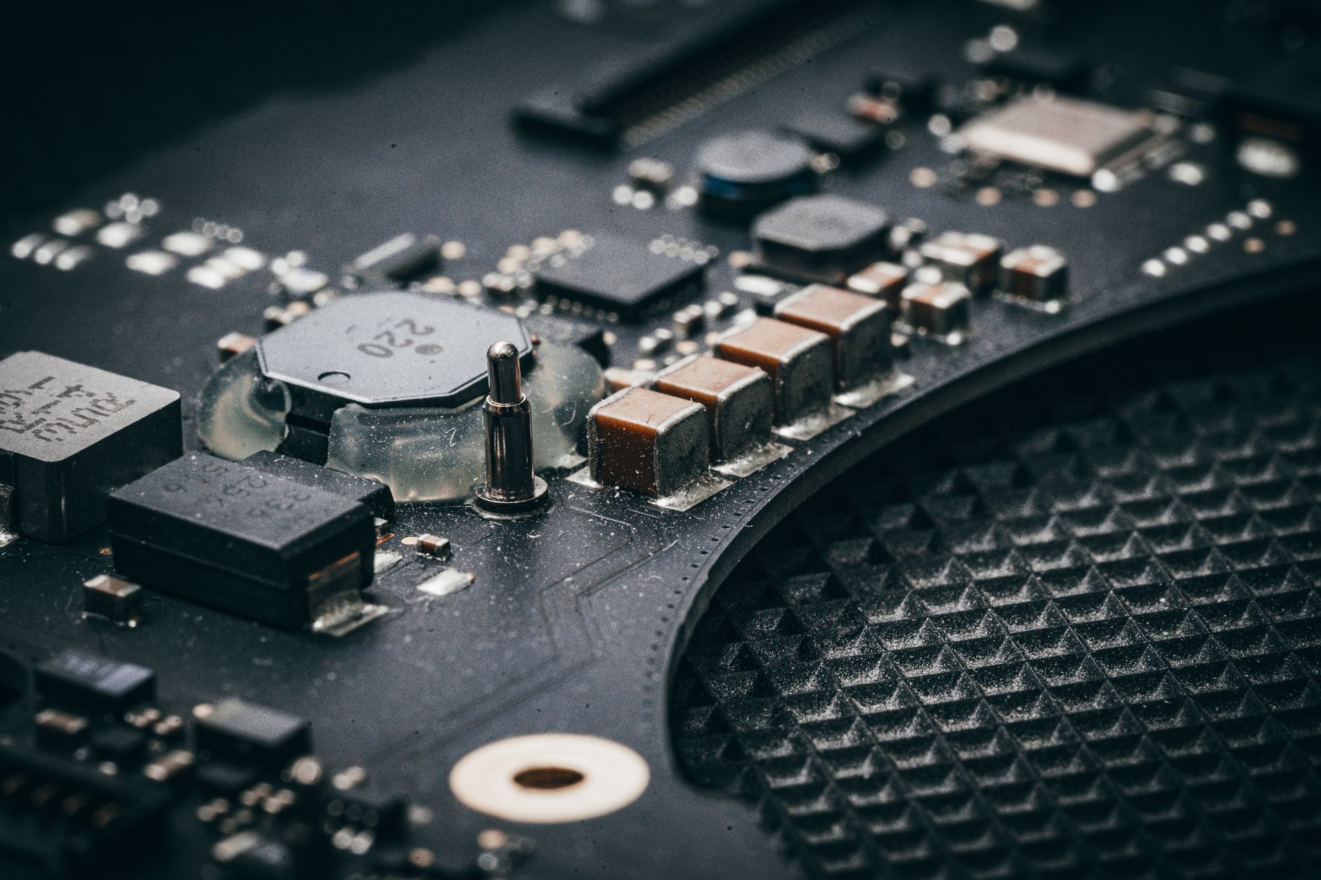 Detailed macro shot of an electronic circuit board showcasing various components.