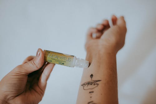 Person Holding Eucalyptus Labeled Soft Tube