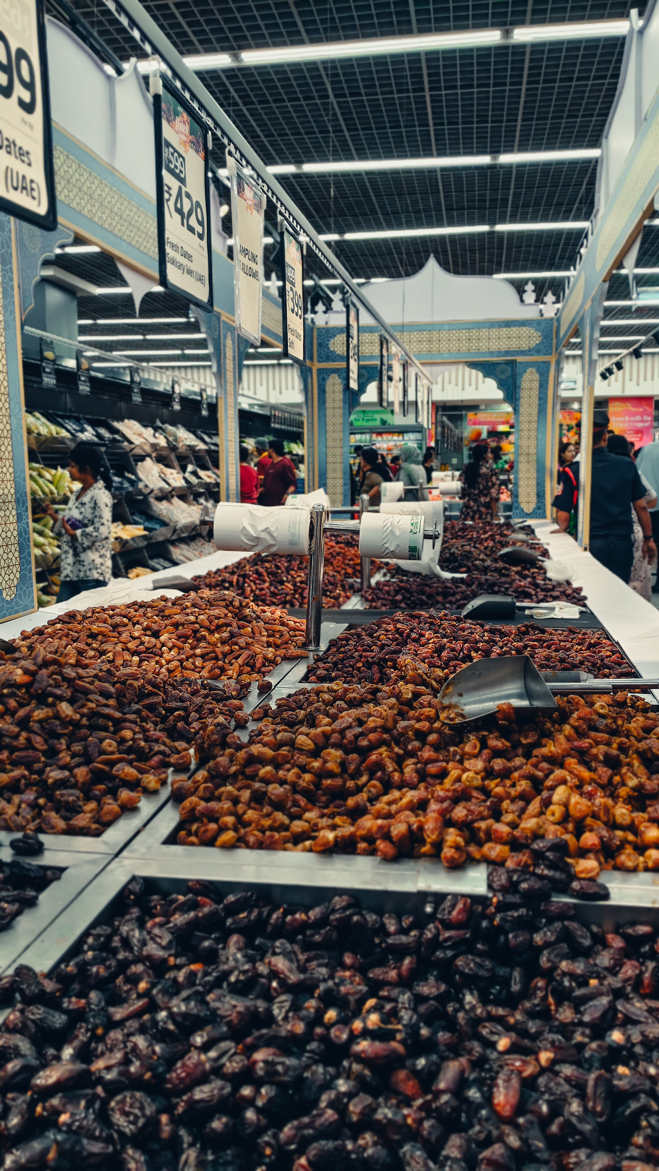 Selection of different dates on display at an indoor market. Busy shopping environment with signs. - Recognizing Red Flags in Online Stores