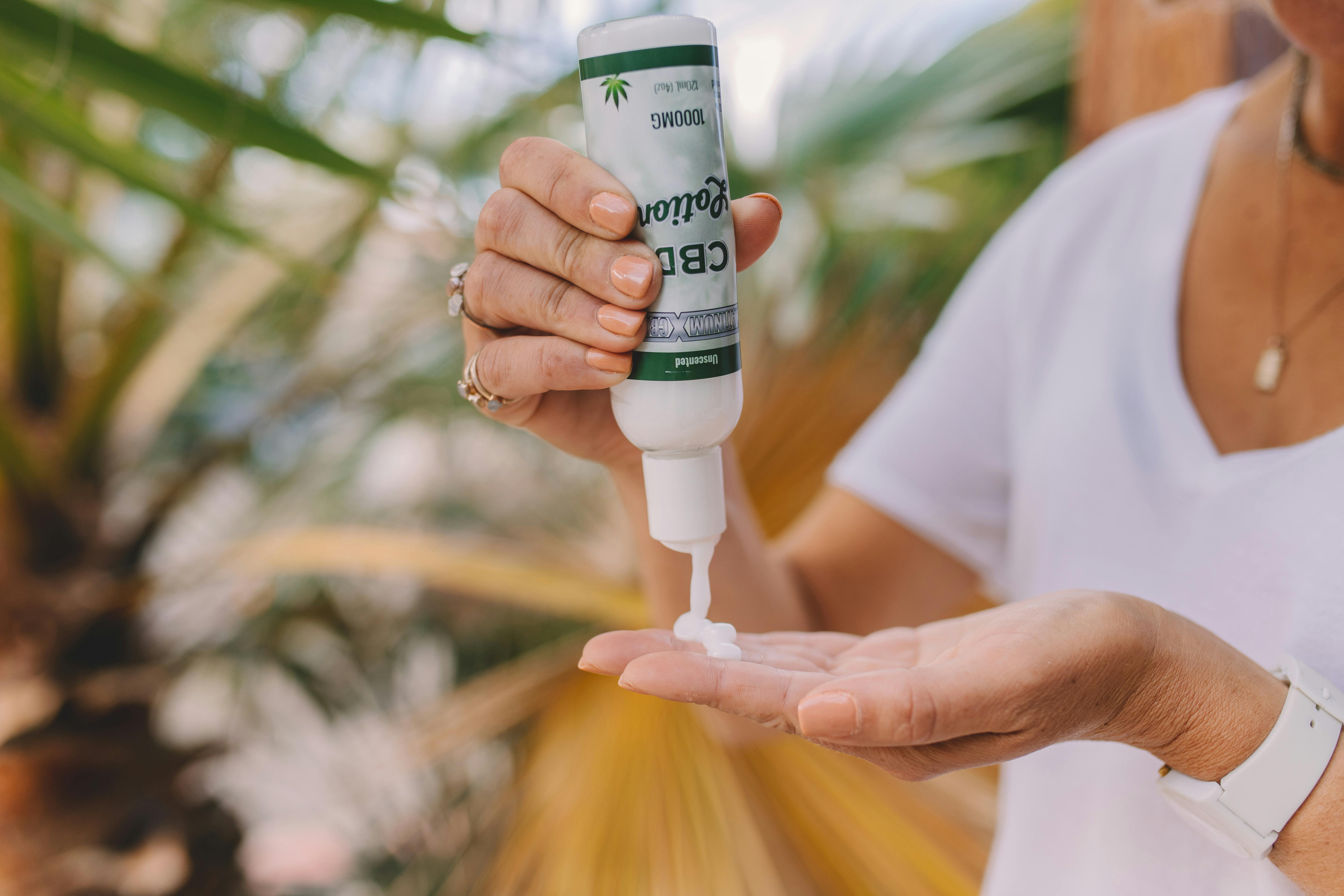 Free Person Holding White Plastic Bottle Stock Photo