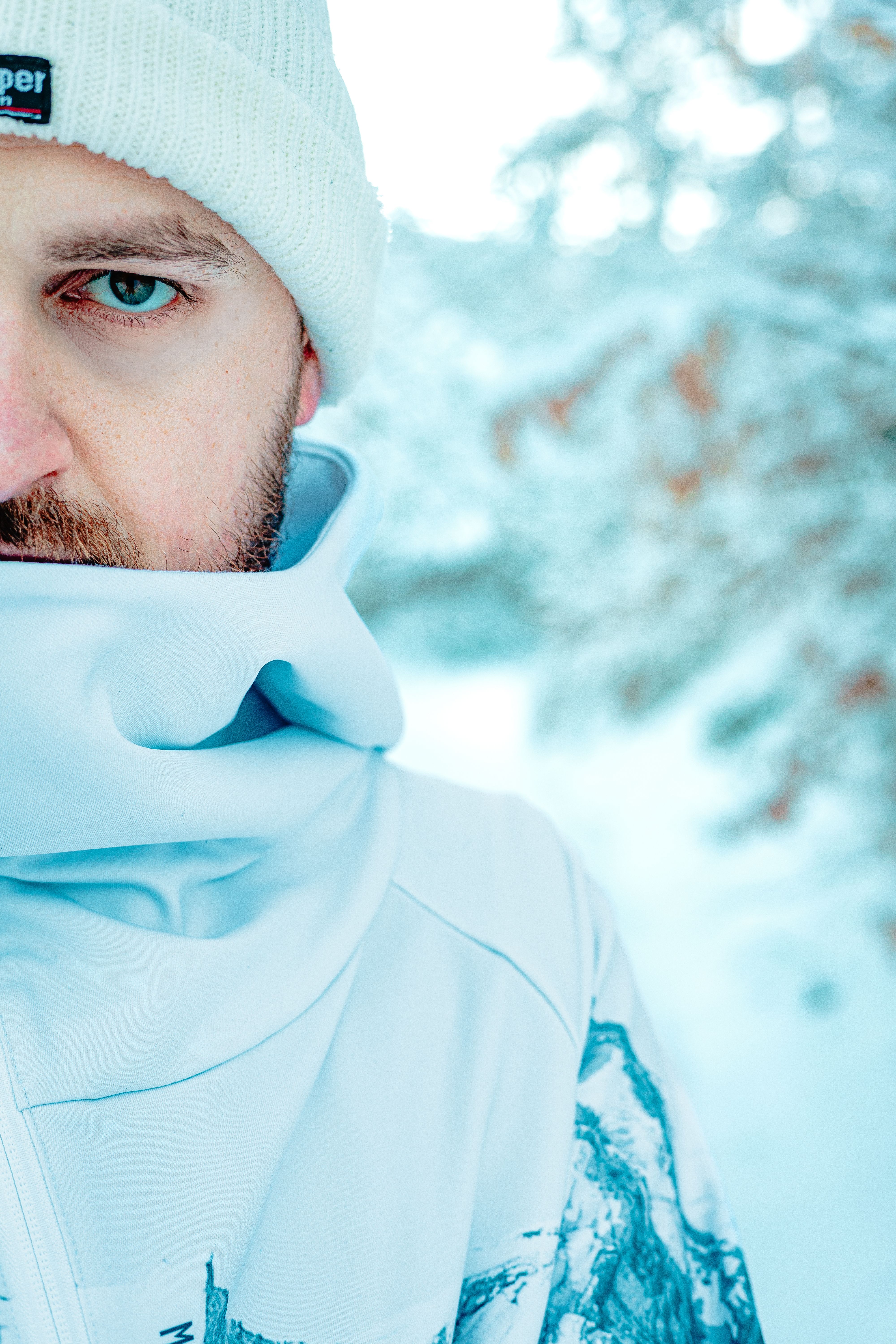 Close-up portrait of a man dressed for winter in a snowy forest in Čajniče, Bosnia and Herzegovina.