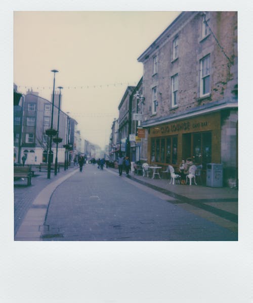 Photo of People Walking on Street