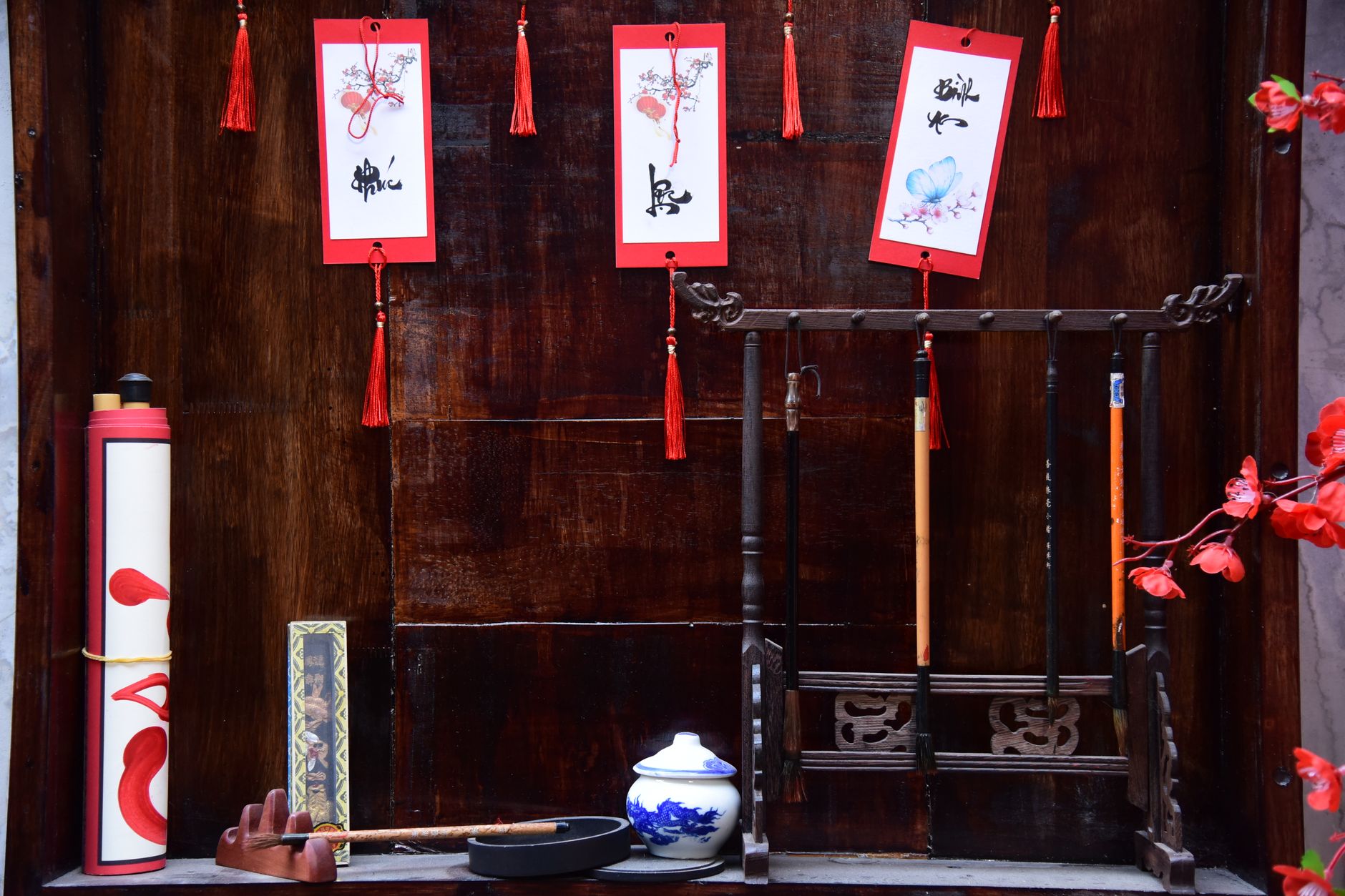 Intricate setup of Chinese calligraphy tools and decorative elements, showcasing artistic tradition.