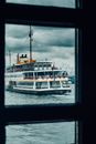 Small cruise ship on waving river