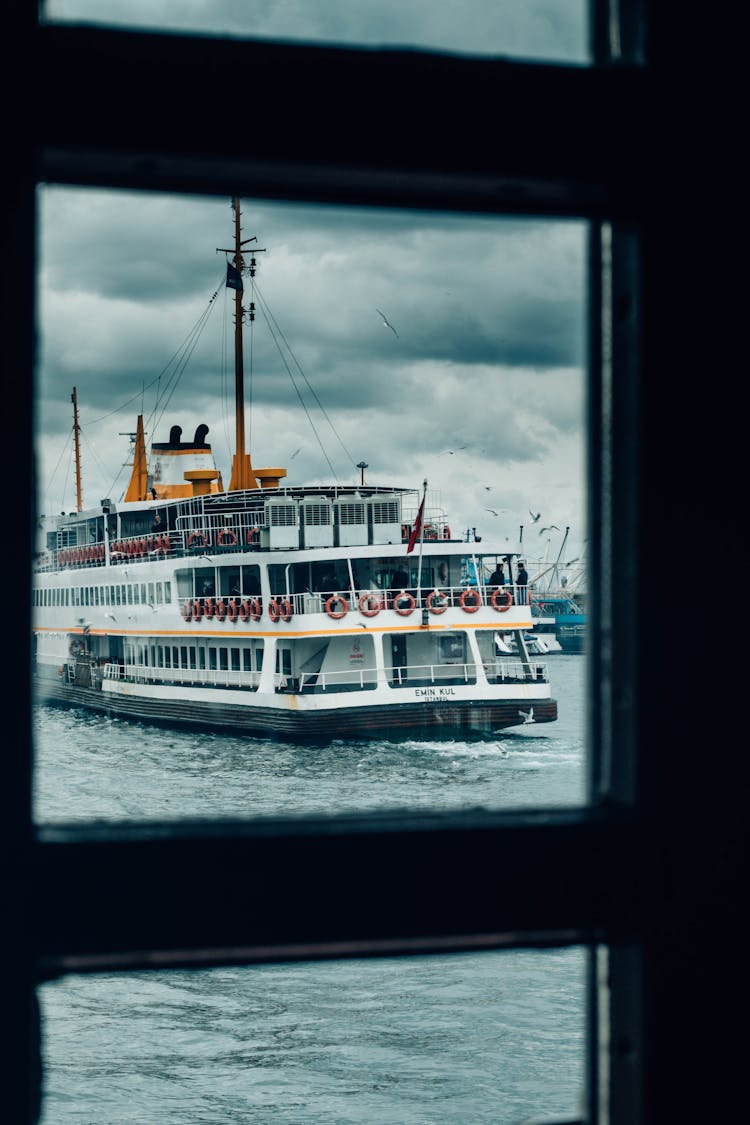 Small Cruise Ship On Waving River