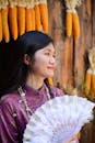 Portrait of Woman with Traditional Attire and Fan