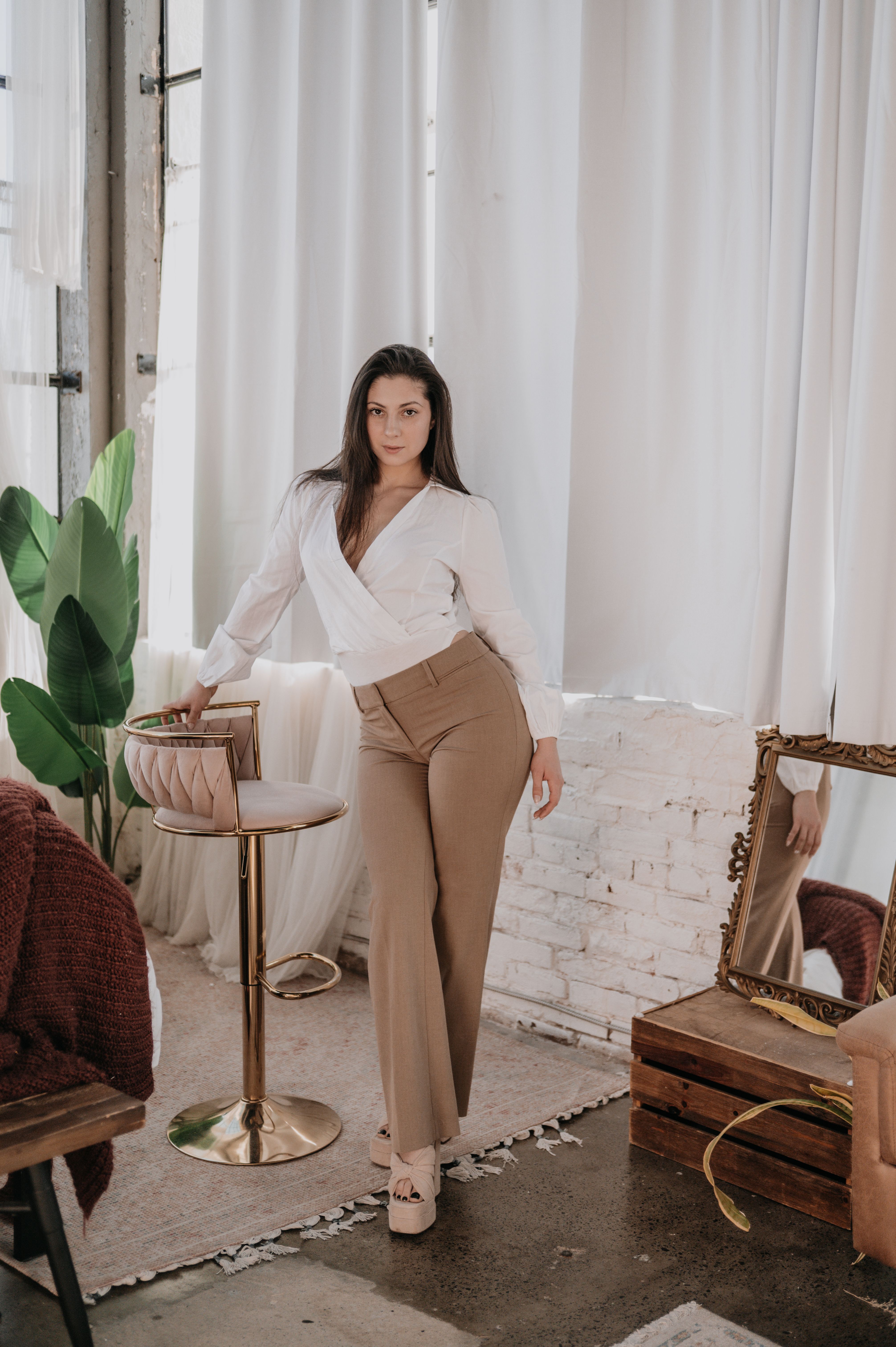 Trendy Young Woman in Stylish Indoor Setting · Free Stock Photo