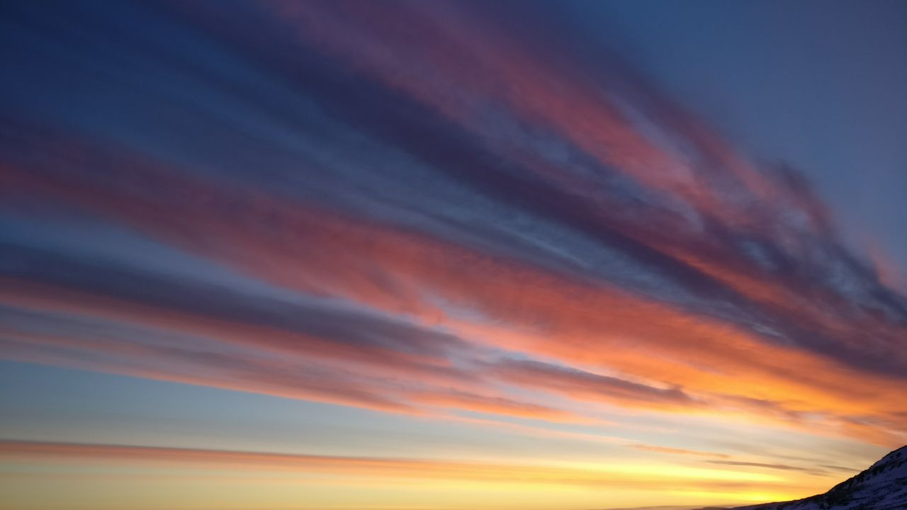 dramatic sunset sky with colorful clouds over westfjords iceland