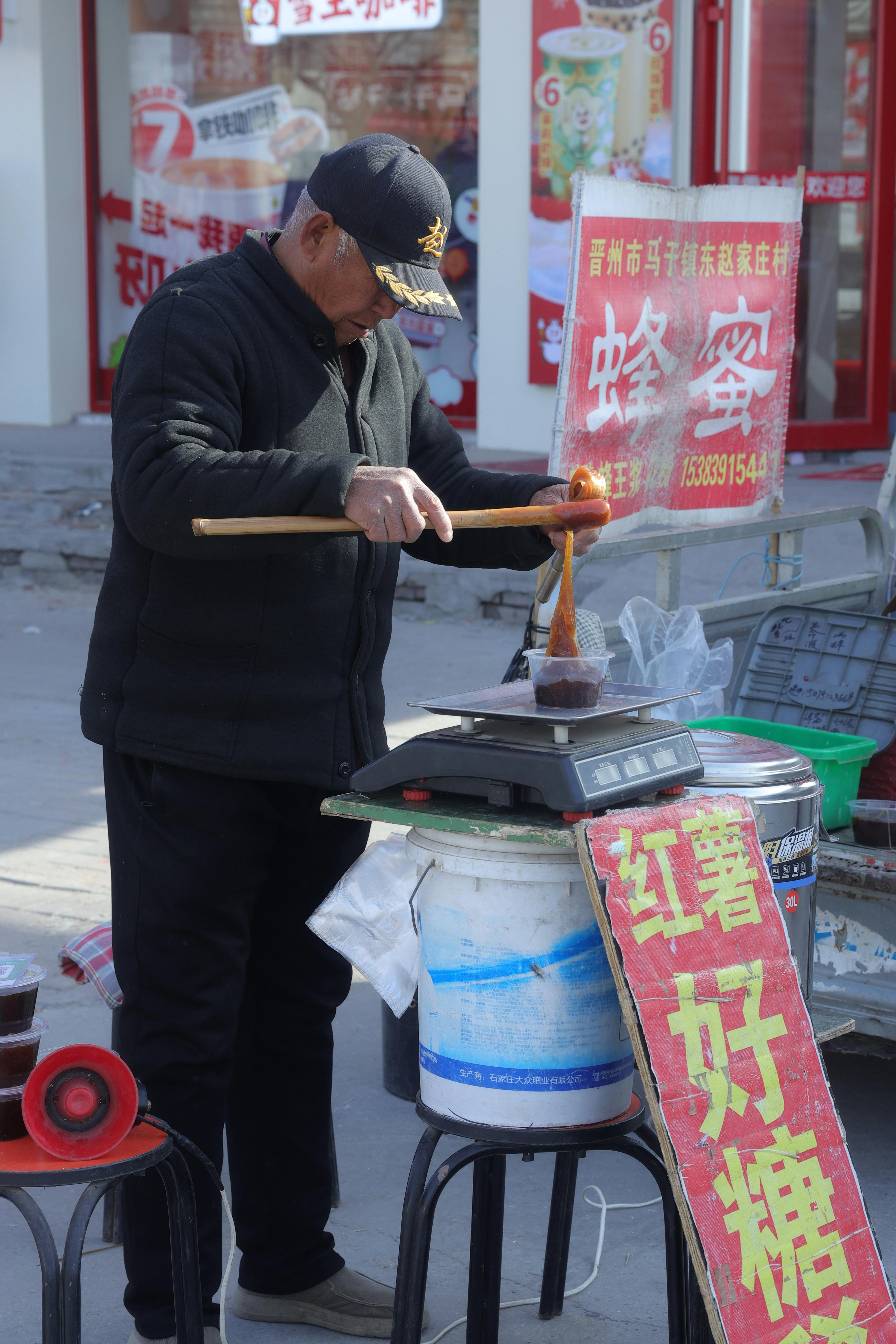 Street Vendor Preparing Traditional Asian Snack