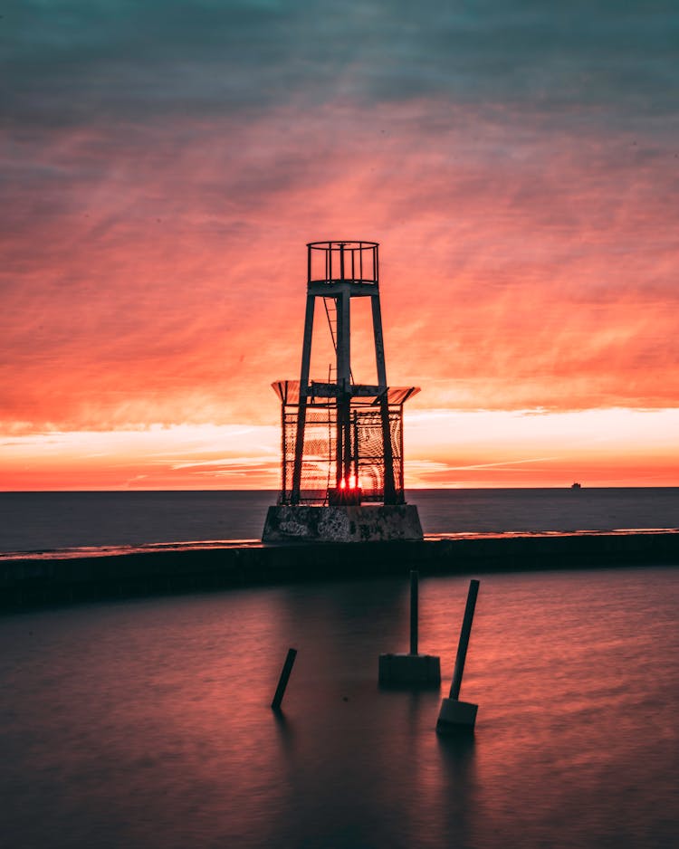 Silhouette Of Ship On Sea During Sunset