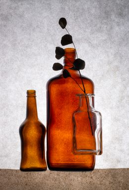 Amber bottles with dried stems, photo by Valentin Ivantsov on Pexels