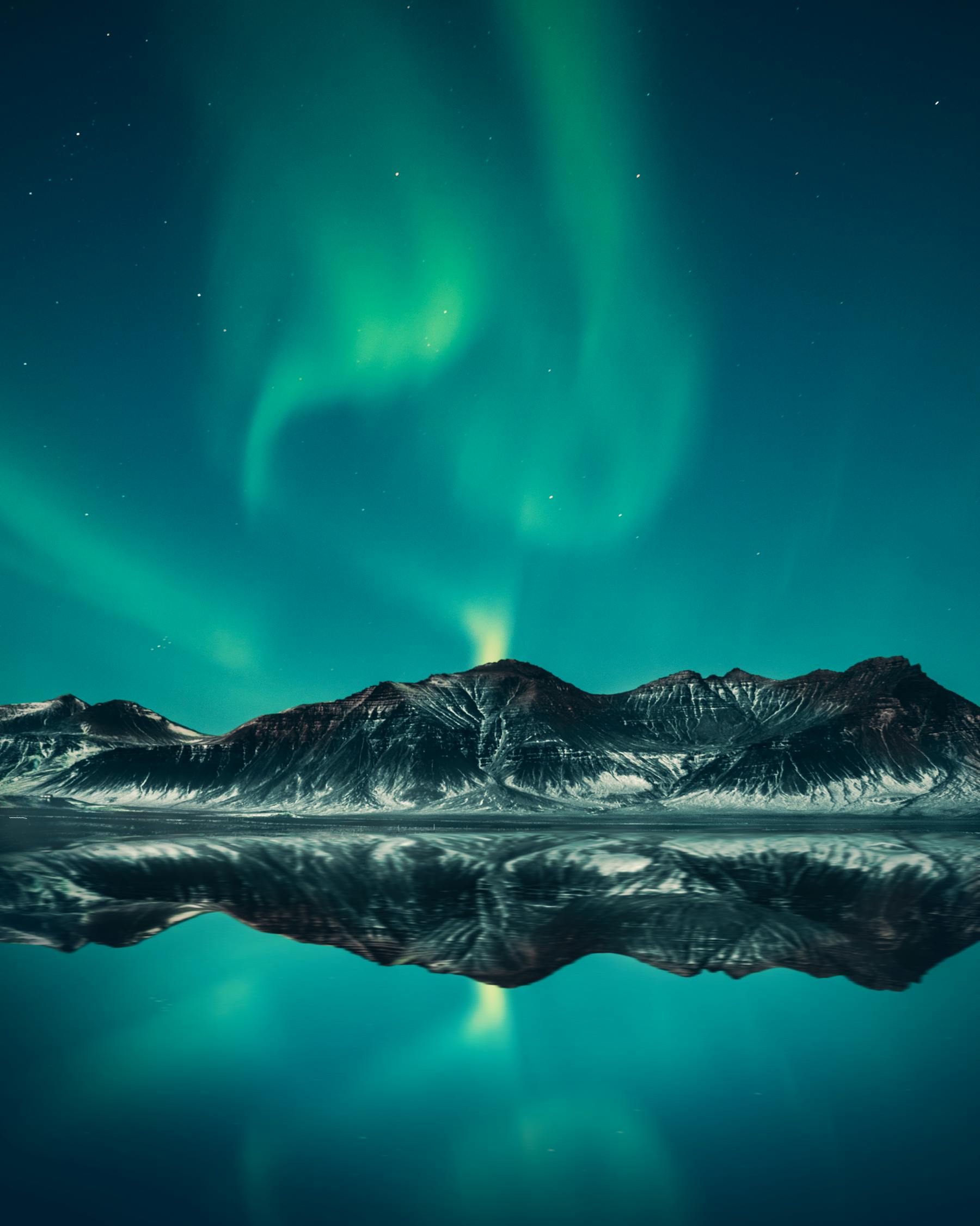 Aurora Burealis over Iceland's icy mountains