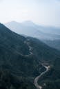 Aerial View of Winding Mountain Road at Daytime