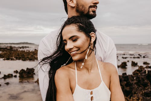 Free Photo of Woman Standing in Front of Man Stock Photo