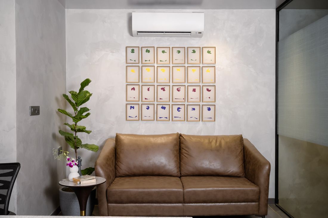 Modern living room with painted walls, sofa and wall art