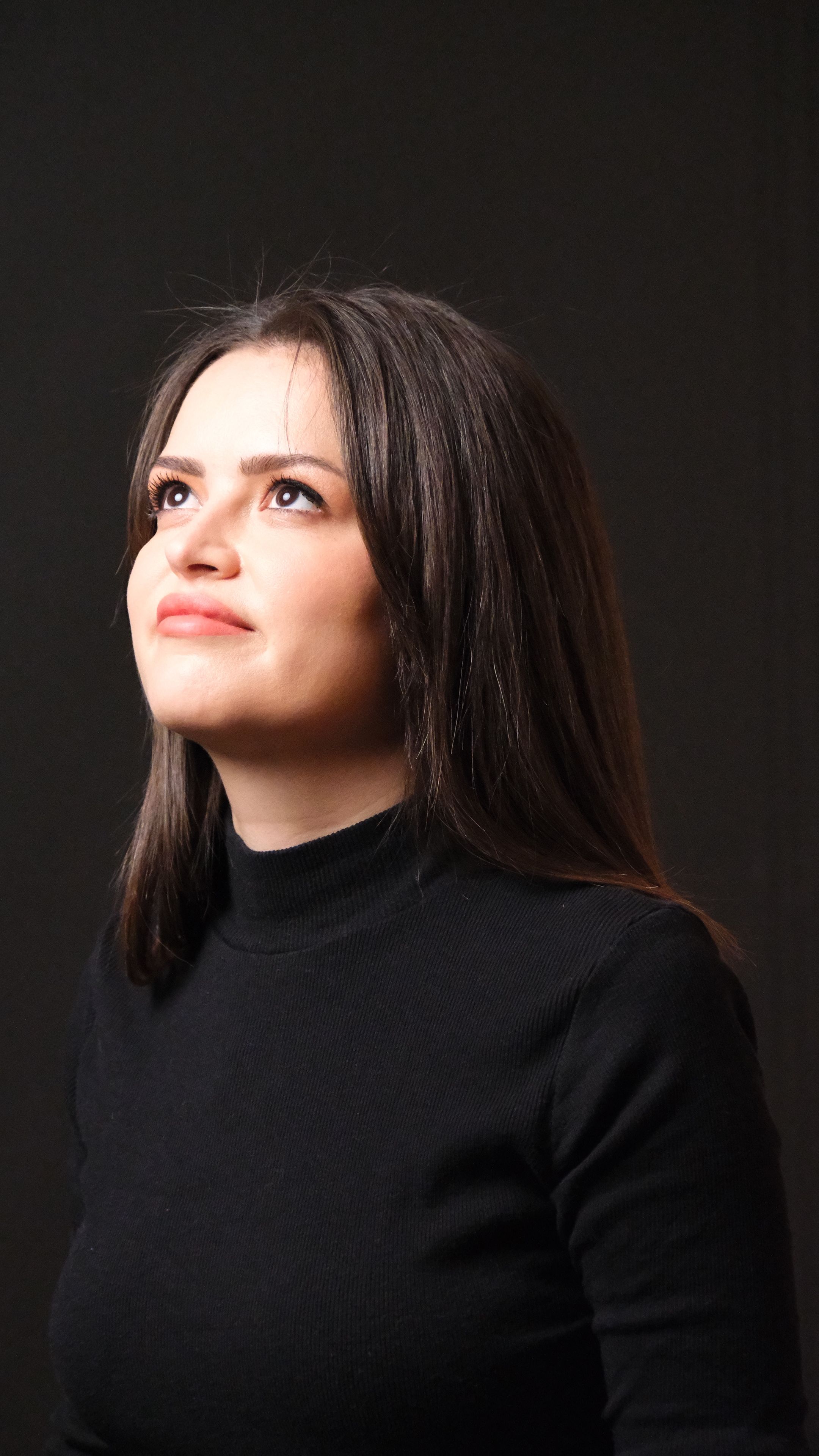 Contemplative Portrait of a Woman Against Dark Background · Free Stock ...