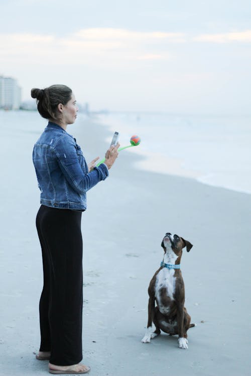 Free Woman and Her Pet Dog Stock Photo