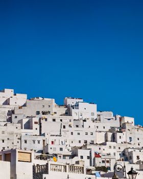 Stunning view of whitewashed buildings against a vibrant blue sky in Tétouan, Morocco.