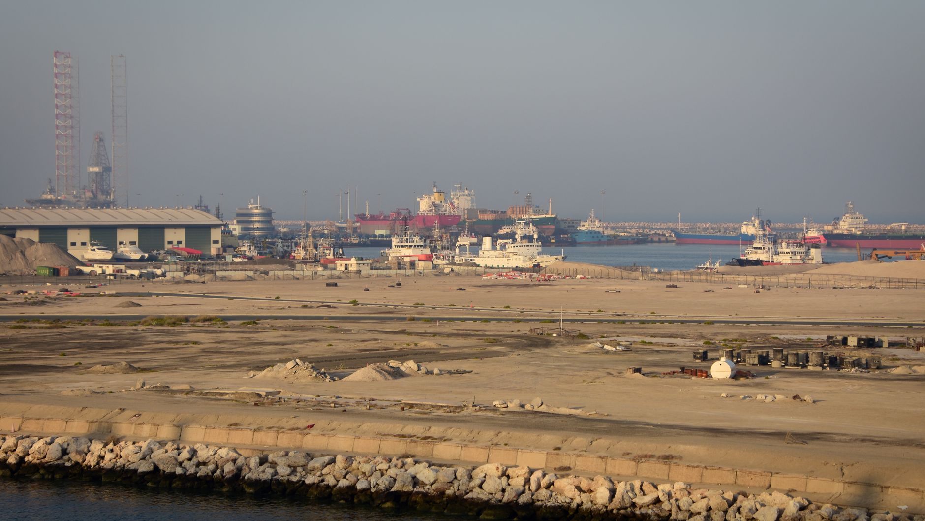 Dubai's iconic skyline and its bustling port of Jebel Ali symbolize its economic might, but this image now represents the interconnected pillars under severe threat from regional instability and trade disruptions.