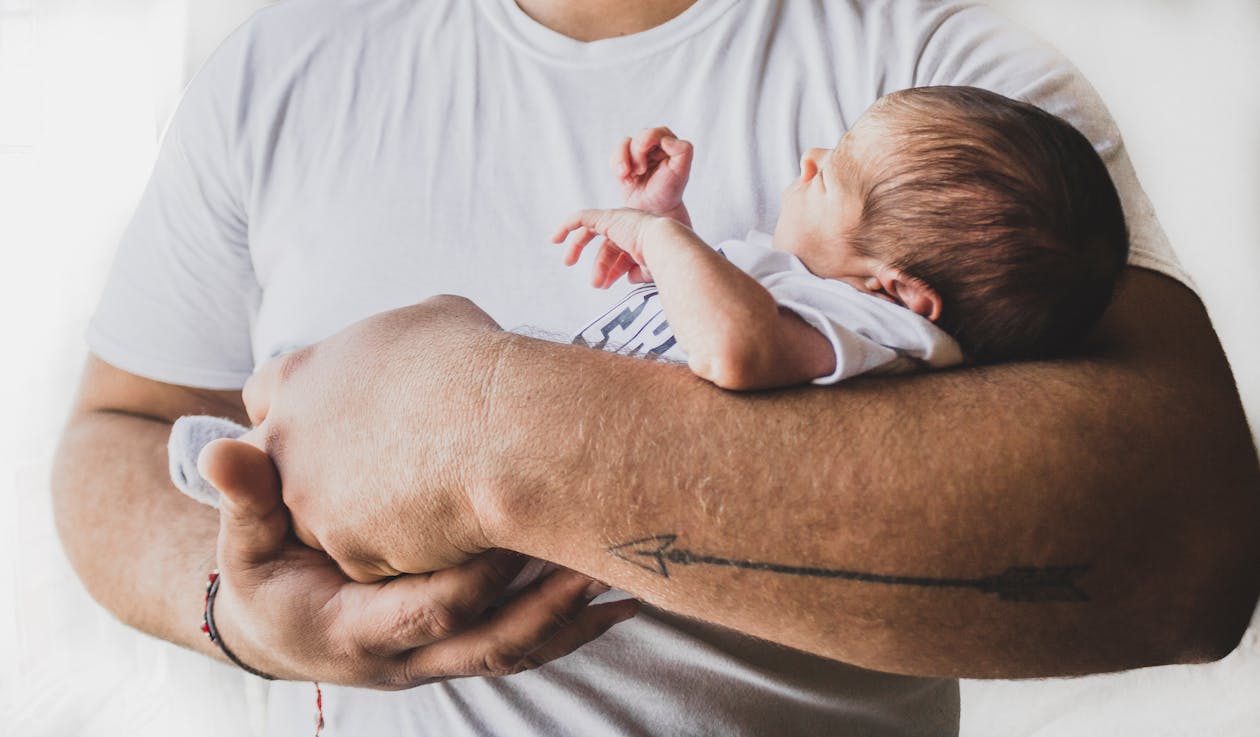 Free Photo Of Person Carrying Newborn Baby Stock Photo