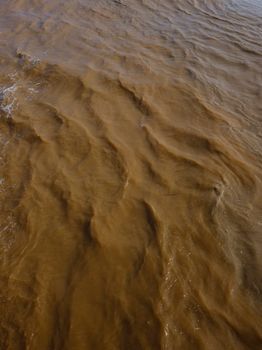dark black river mud