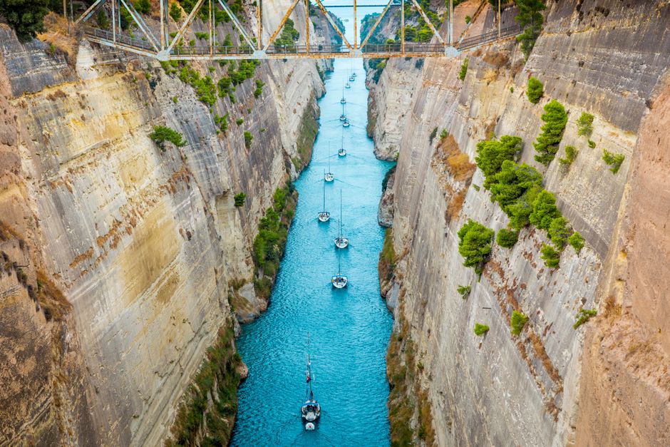 Stunning All-Inclusive Full-Day Cruise & Lunch Review: Sailing Greece's Stunning Sporades Islands Review 2026 - A breathtaking view of yachts navigating the narrow Corinth Canal in Greece, emphasizing the engineering marvel.